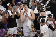 Denver Nuggets center Nikola Jokic, center, is presented with the series MVP trophy after defeating the Los Angeles Lakers in Game 4 of the NBA basketball Western Conference Final series Monday, May 22, 2023, in Los Angeles. (AP Photo/Mark J. Terrill)