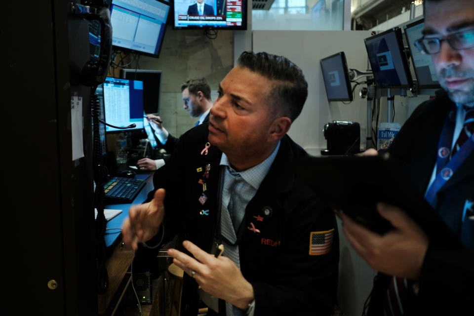 NEW YORK, NEW YORK - MARCH 18: Traders work on the floor of the New York Stock Exchange (NYSE) on March 18, 2020 in New York City. The Dow fell more than 1,200 points today as COVID-19 fears continue to roil world markets. (Photo by Spencer Platt/Getty Images)