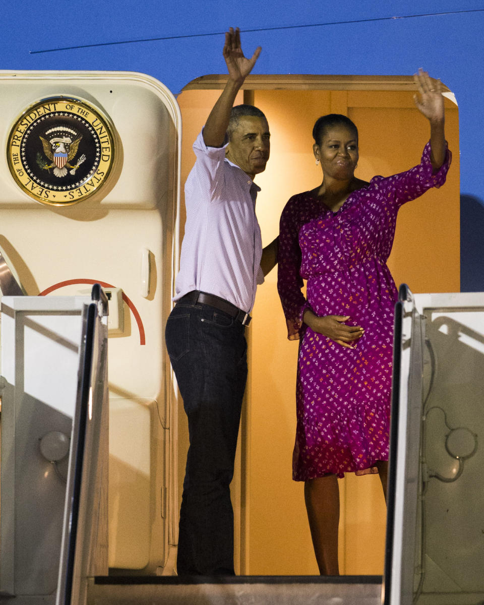 Michelle Obama waves goodbye to Hawaii from Air Force One at the Joint Base Pearl Harbor-Hickam in Honolulu. 