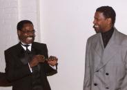 Rubin "Hurricane" Carter (L) poses with actor Denzel Washington at the premier of the film "The Hurricane" in this file photo taken in Los Angeles December 14, 1999. Carter died on April 20, 2014, in Toronto after a battle with prostate cancer. He was 76. REUTERS/Fred Prouser/Files (UNITED STATES - Tags: ENTERTAINMENT SPORT OBITUARY)