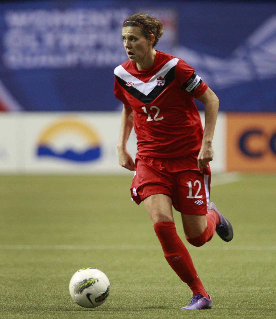 VANCOUVER, CANADA - JANUARY 23: Christine Sinclair #12 of Canada dribbles the ball up field during their game against Costa Rica at the 2012 CONCACAF Womenâ€™s Olympic Qualifying Tournament at BC Place on January 23, 2012 in Vancouver, British Columbia, Canada. (Photo by Jeff Vinnick/Getty Images)