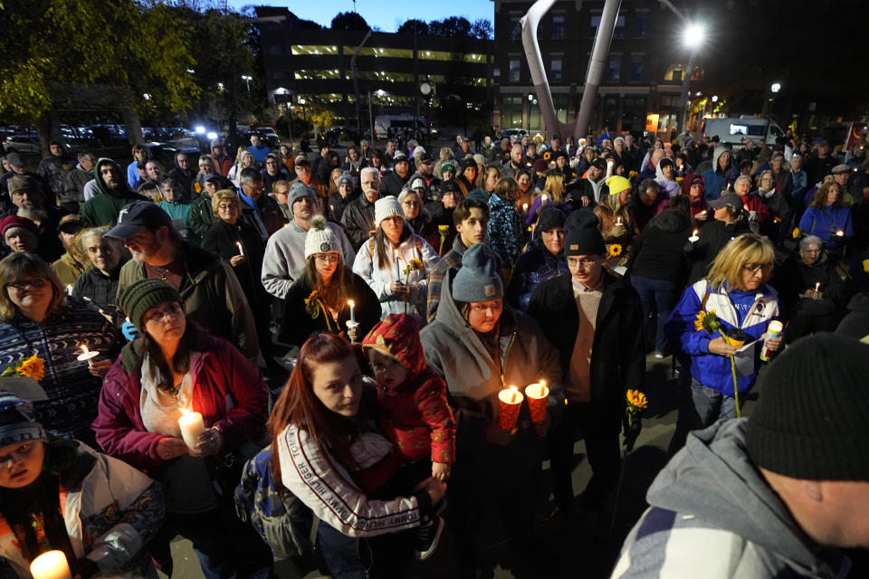 Community members gather Thursday, Nov. 2, 2023, during a candlelight vigil in Auburn, Maine. Locals seek a return to normalcy after a mass shooting in Lewiston on Oct. 25. (AP Photo/Matt York)