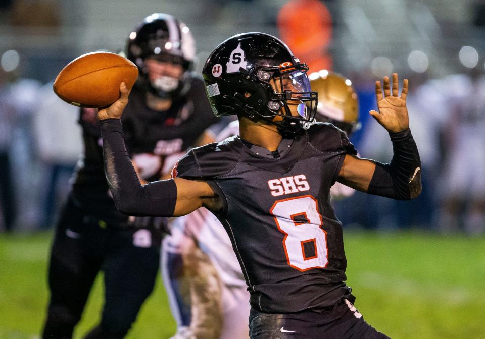 Springfield's Rashad Rochelle (8) loads up for a pass against Lemont in the second half during the second round of the 6A playoffs at Memorial Stadium in Springfield, Ill., Friday, November 5, 2021. [Justin L. Fowler/The State Journal-Register] 