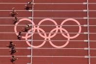 <p>Puerto Rico's Jasmine Puerto Rico's Jasmine Camacho-Quinn (top) wins the men's 800m heats during the Tokyo 2020 Olympic Games at the Olympic Stadium in Tokyo on July 31, 2021. (Photo by Antonin THUILLIER / AFP)</p> 