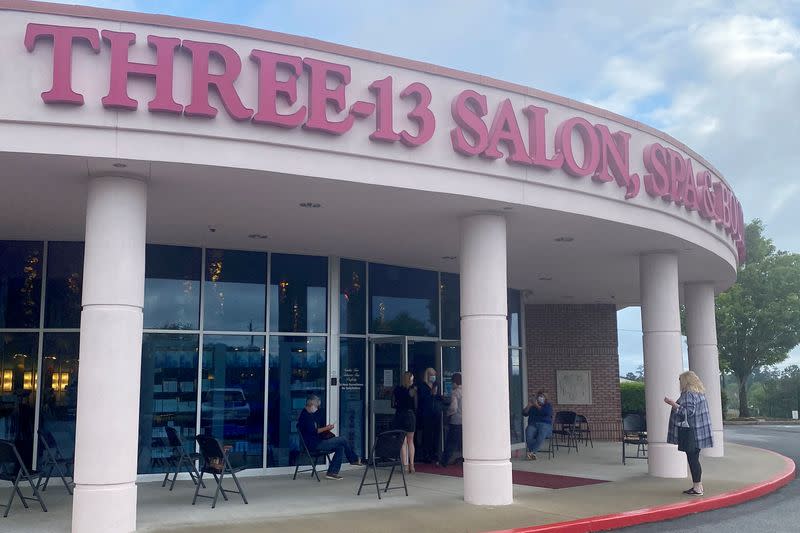 A customer approaches the Three-13 Salon, Spa & Boutique in Marietta