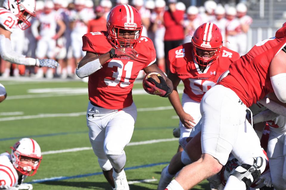 Albany's Jaheim Newton (31) cuts to the outside on a run against Muenster during the Region II-2A Division II semifinal. Newton rushed 23 times for 163 yards and a touchdown in the 34-21 win.