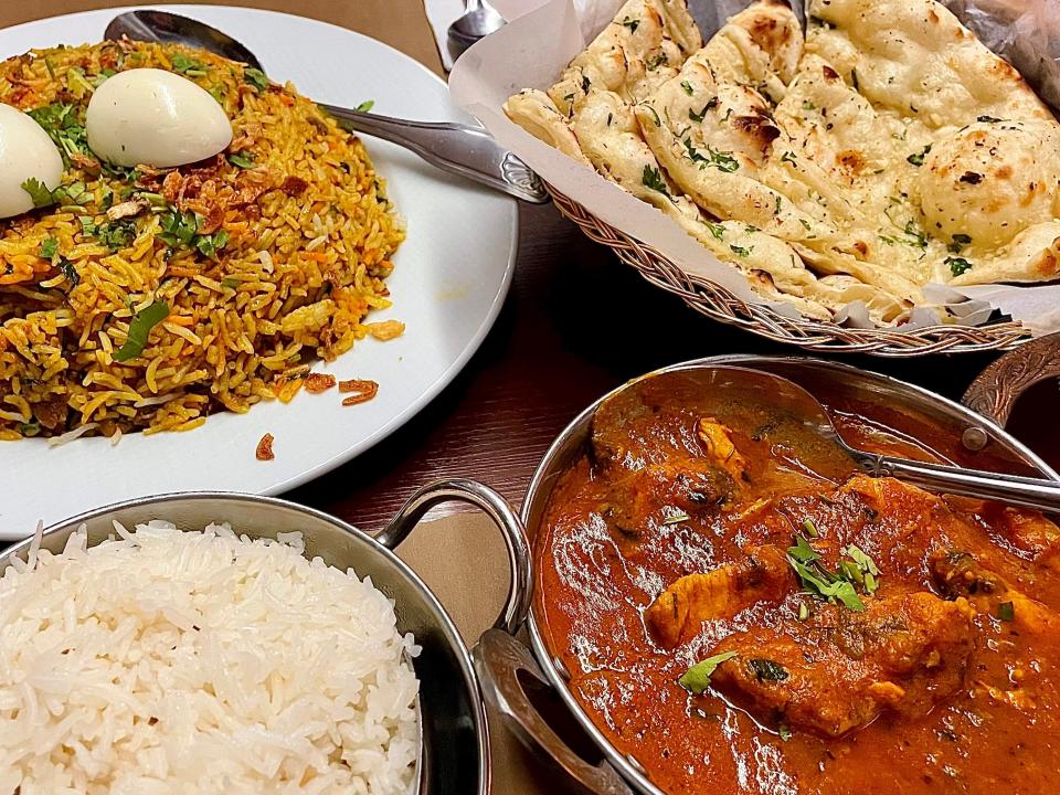 Garlic naan, vegetable samosa and chicken curry from Ammrit Indian Cuisine in South Daytona.