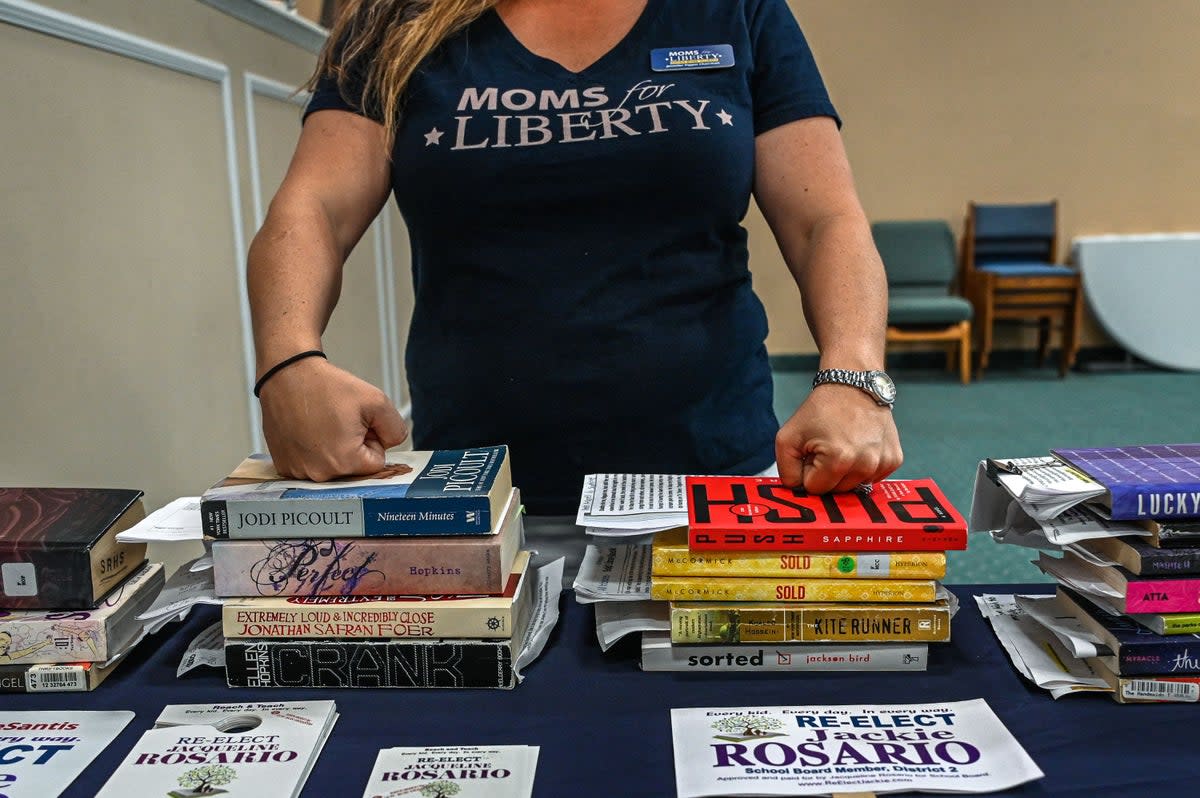 Jennifer Pippin, president of the local Moms for Liberty chapter, pictured with several books. She advocated to ban “Ban This Book” by Alan Gratz in the Indian River County School District (AFP via Getty Images)