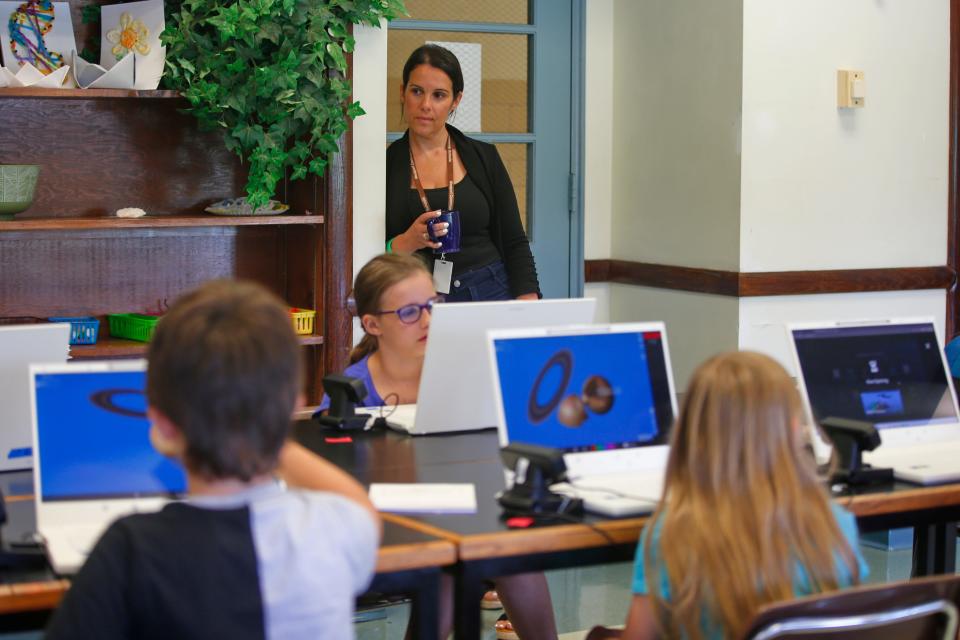 In this file photo, Out of School Time Director Jennifer Chaves looks on as a group of summer program students use the district's new zSpace laptops. It was the first time the district has used the devices, which will be used in the high school's new "neo-technical" programming this school year.