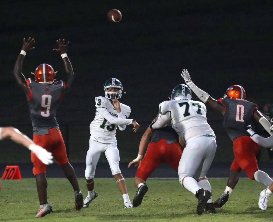 Flagler Palm Coast QB Caden Gonzalez (13) fires a pass against University, Thursday, Sept. 21, 2023.