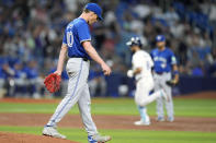 Toronto Blue Jays starting pitcher Chris Bassitt (40) walks back to the mound as Tampa Bay Rays' Brandon Lowe runs the bases following his grand slam during the third inning of a baseball game Friday, March 29, 2024, in St. Petersburg, Fla. (AP Photo/Chris O'Meara)
