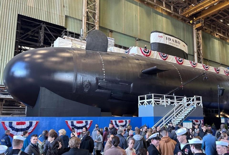 Spectators observe the pre-commissioning unit Idaho (SSN 799)