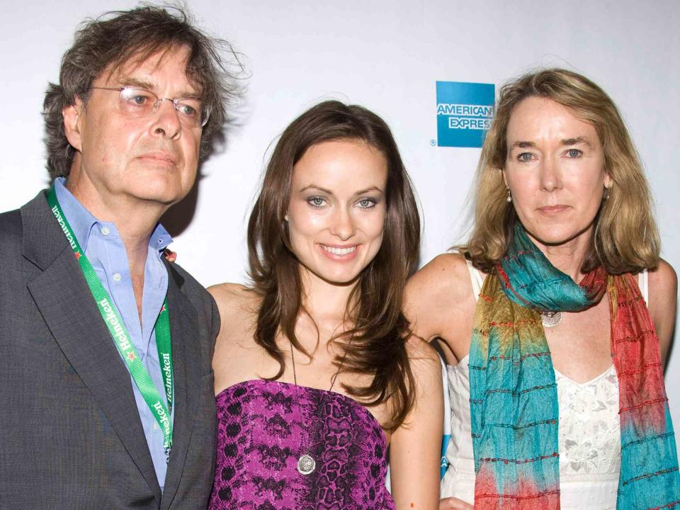 <p>Charles Sykes/Shutterstock</p> Olivia Wilde with parents Andrew and Leslie Cockburn at the 