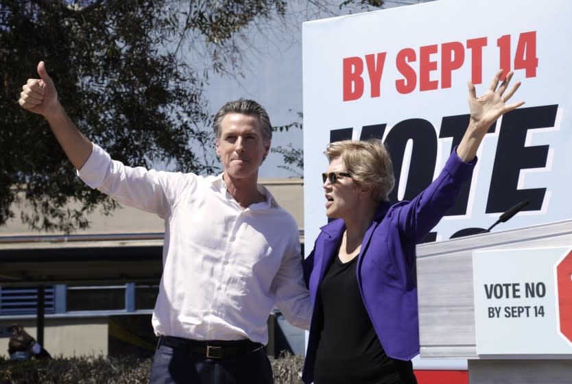 CULVER CITY, CA - SEPTEMBER 4, 2021 - California Governor Gavin Newsom and U.S. Senator Elizabeth Warren greet a crowd of supporters at a rally against the recall at Culver City High School in Culver City on September 4, 2021. (Genaro Molina / Los Angeles Times)