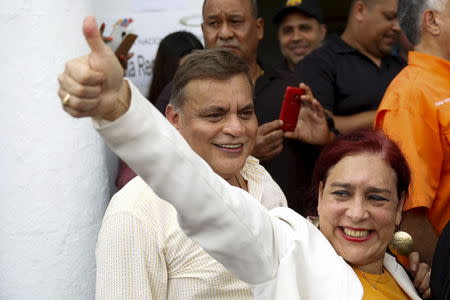 Tamara Adrian gives a thumbs up to supporters as she arrives to register her candidacy for the upcoming parliamentary elections at an office of the National Electoral Council (CNE) in Caracas August 7, 2015. REUTERS/Carlos Garcia Rawlins