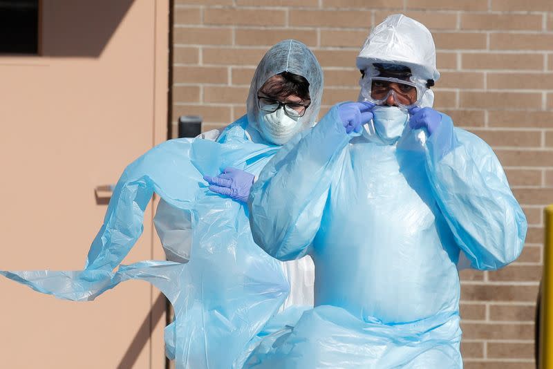 Healthcare workers in PPE outside Wyckoff Heights Medical Center during outbreak of coronavirus disease (COVID-19) in New York