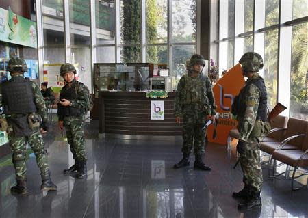 Thai soldiers occupy the foyer of the National Broadcasting Services of Thailand television station in Bangkok May 20, 2014. REUTERS/Athit Perawongmetha