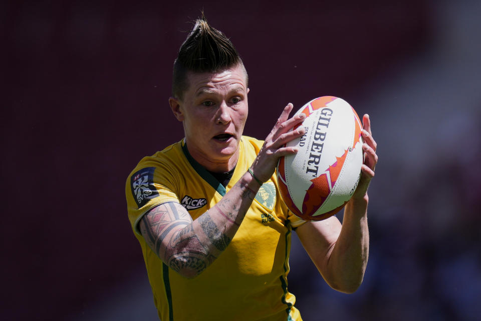 FILE - Raquel Kochhann of Brazil competes during the women's HSBC Rugby Sevens match between Brazil and Belgium in Madrid, Spain, Friday, May 31, 2024. A breast cancer diagnosis, surgery and months of follow-up treatment didn't shake Kochhann's desire to return to rugby sevens and have a shot at a third Olympics. (AP Photo/Bernat Armangue,File)