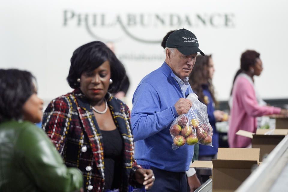 President Joe Biden volunteers at Philabundance, a hunger relief organization, to mark Martin Luther King, Jr., day, Monday, Jan. 15, 2024, in Philadelphia, with Philadelphia Mayor Cherelle Parker, second left. (AP Photo/Evan Vucci)