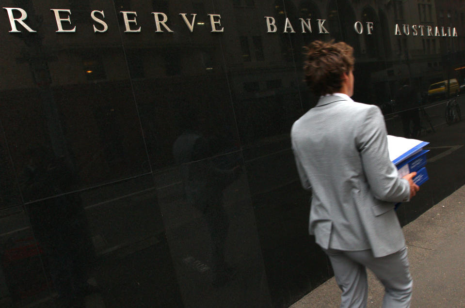 A man walks past the Reserve Bank of Australia in Sydney, Tuesday, June 5, 2012. Australia's central bank has cut its benchmark interest rate for a second consecutive month, lowering it a quarter percentage point to 3.5 percent. (AP Photo/Rick Rycroft)