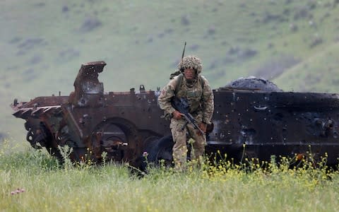 A British soldier takes part in the joint military exercise 'Noble Partner 2016' at the military base of Vaziani outside Tbilisi, Georgia, May 18, 2016. - Credit: ZURAB KURTSIKIDZE/EPA