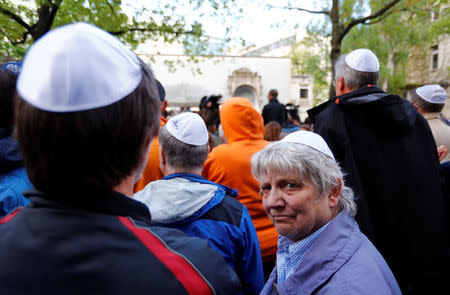 People wear kippas during a demonstration in front of a Jewish synagogue, to denounce an anti-Semitic attack on a young man wearing a kippa in the capital earlier this month, in Berlin, Germany, April 25, 2018. REUTERS/Fabrizio Bensch