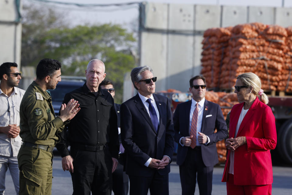 U.S. Secretary of State, Antony Blinken, third right, stands between Israeli Defense Minister Yoav Gallant, third left, and UN Senior Humanitarian and Reconstruction Coordinator for Gaza, Sigrid Kaag, right, at the Kerem Shalom border crossing in Kerem Shalom, Israel, May 1, 2024. (Evelyn Hockstein/Pool Photo via AP, File)