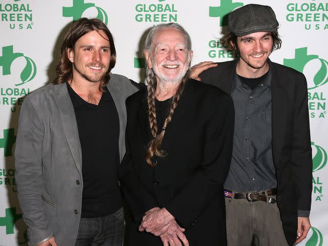 David Livingston/Getty Willie Nelson with sons Lukas and Micah in 2013.