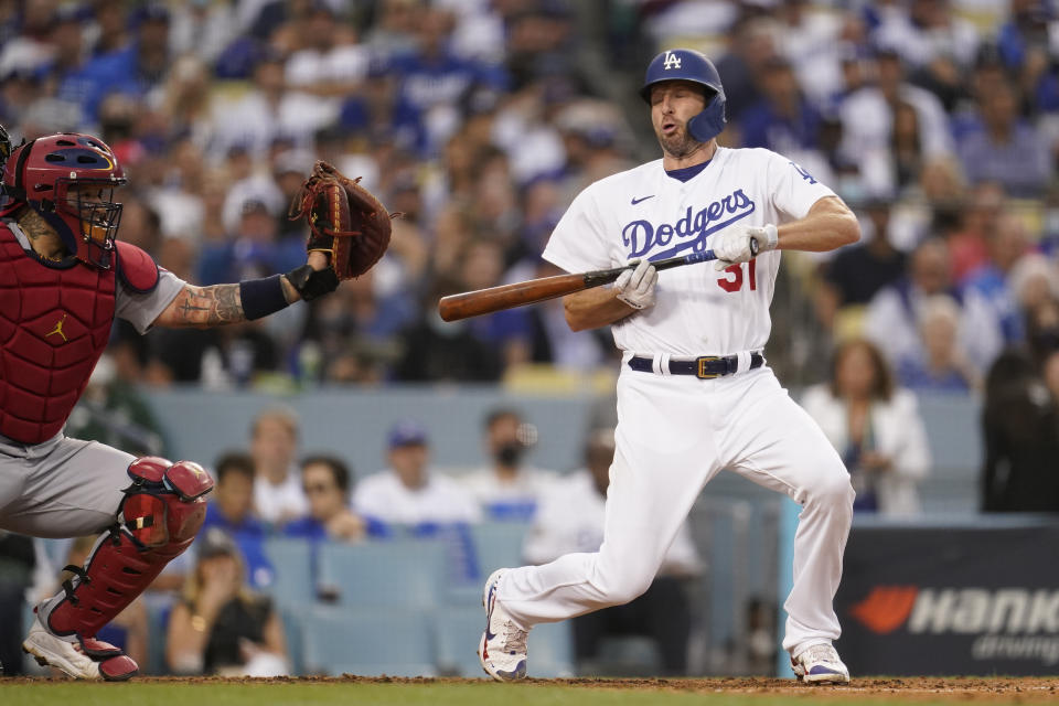 Los Angeles Dodgers' Max Scherzer reacts to a close pitch as he attempted to bunt during the third inning of a National League Wild Card playoff baseball game against the St. Louis Cardinals Wednesday, Oct. 6, 2021, in Los Angeles. St. Louis Cardinals starting pitcher Adam Wainwright threw. (AP Photo/Marcio Jose Sanchez)