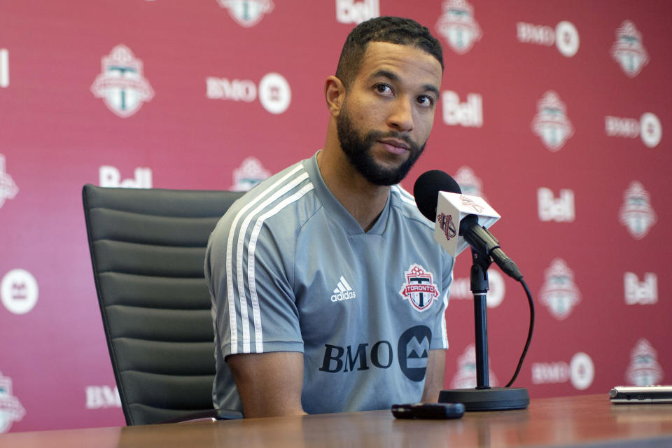 FILE - In this Nov. 13, 2019, file photo, Toronto FC soccer player Justin Morrow speaks to the media during an end of season availability in Toronto. A group of African American Major League Soccer players have formed a coalition to address systematic racism in their communities and bring about change within the league. The coalition is the result of an Instagram group formed after the death of George Floyd at the hands of Minneapolis police, which spawned a wave of nationwide protests against racism and policy brutality. Started by Toronto FC defender Justin Morrow, the group grew to some 70 MLS players, who decided to act and the Black Players Coalition of MLS was born. (Chris Young/The Canadian Press via AP, File)