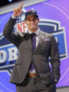 Eastern Illinois quarterback Jimmy Garoppolo reacts after being selected as the 62nd pick by the New England Patriots in the second round of the 2014 NFL Draft, Friday, May 9, 2014, in New York. (AP Photo/Jason DeCrow)