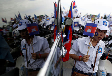 Supporters of the Cambodia National Rescue Party (CNRP) gather during a local election campaign in Phnom Penh, Cambodia May 20, 2017. REUTERS/Samrang Pring