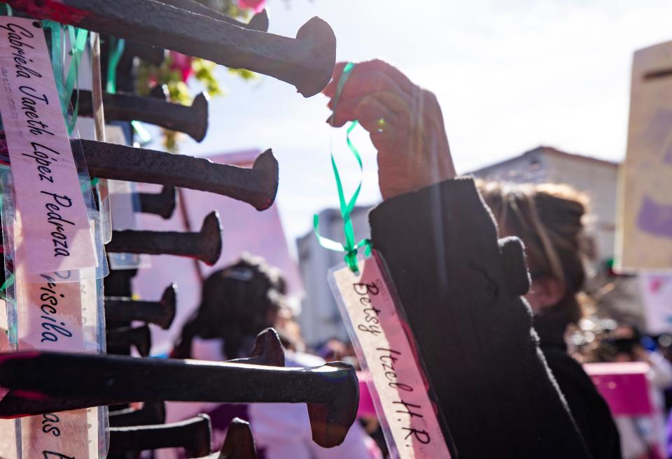 The names of women are set on a monument on the Paso del Norte Bridge as part of a march calling for justice for women on International WomenÕs Day on March 8, 2023 for women on both sides of the border in Ciudad Juarez. 