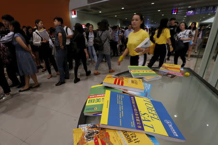 Related textbooks are seen as students take part in SAT examinations at Asia-World Expo near Hong Kong Airport in Hong Kong, China October 3, 2015. Picture taken October 3, 2015. REUTERS/Bobby Yip