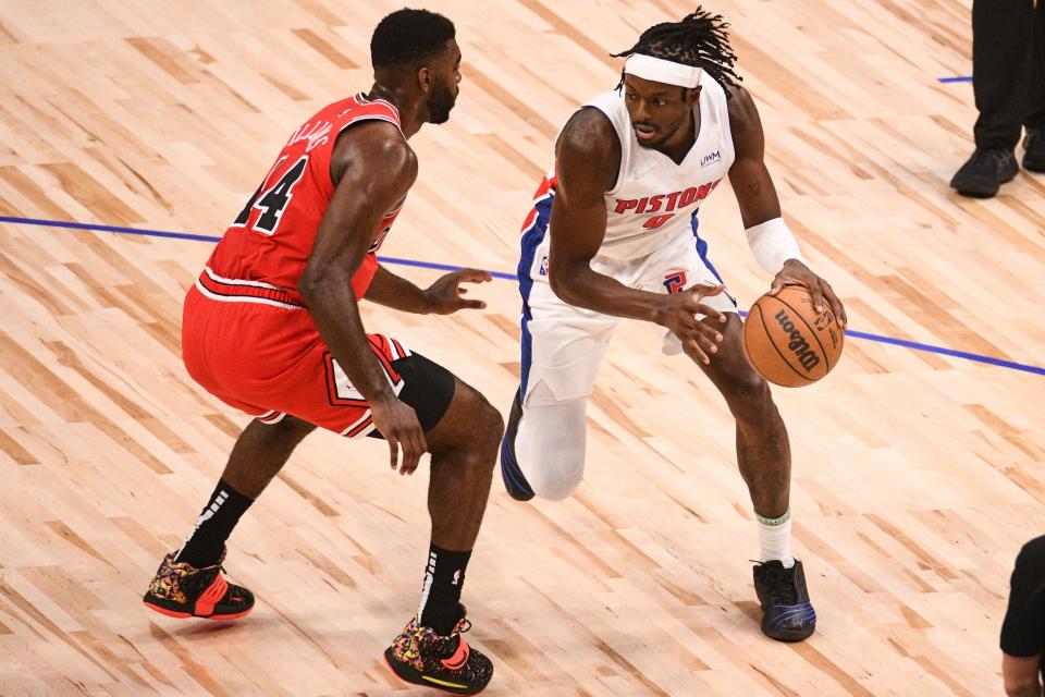 Jerami Grant defended by Bulls forward Patrick Williams during the season opener at Little Caesars Arena, Oct. 20, 2021.