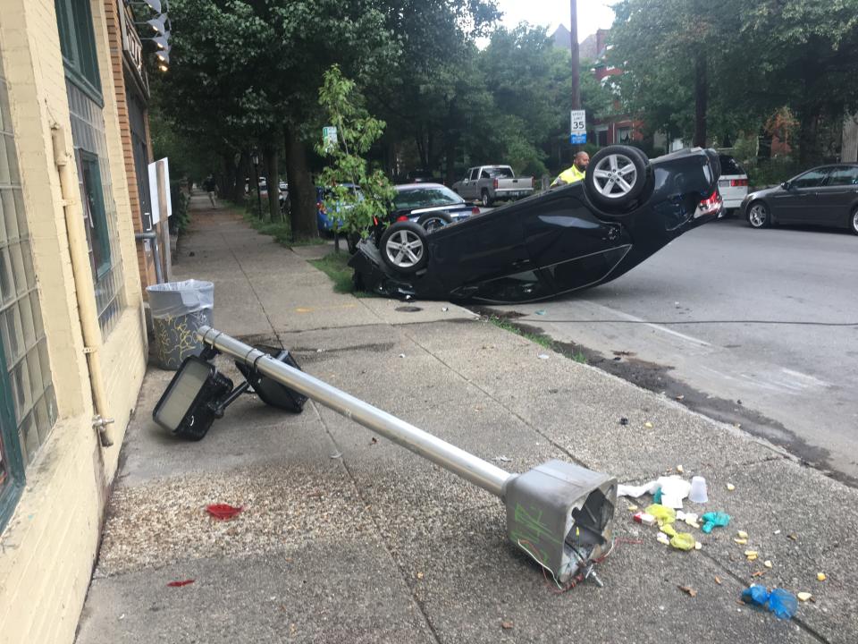 Car crashes and flips into pole outside Magnolia Bar, located at Second Street and Magnolia Avenue in Old Louisville