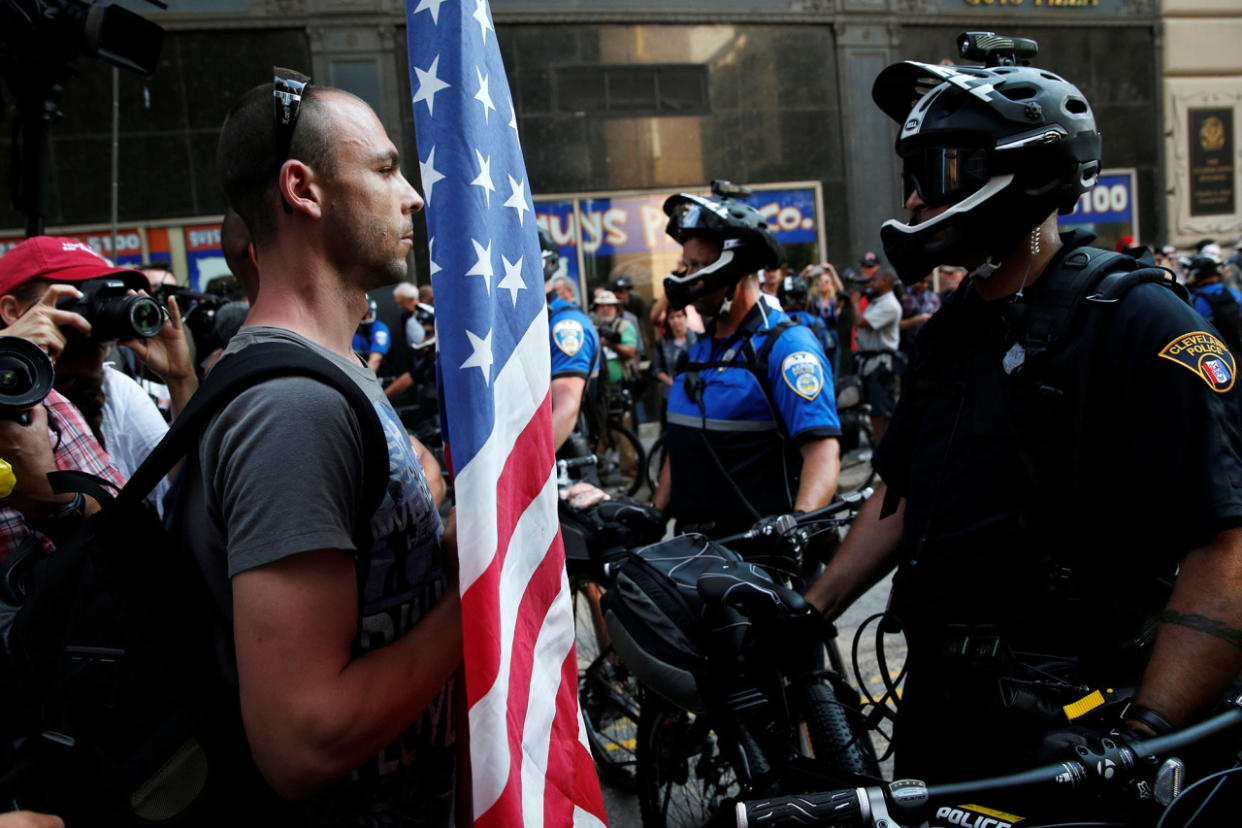 A demonstrator faces a police officer during protests outside the Republican National Convention in Cleveland on Tuesday. (Photo: Andrew Kelly/Reuters)