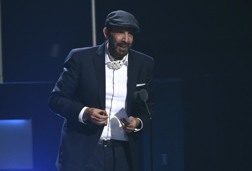 FILE - Juan Luis Guerra accepts the award for best contemporary/tropical fusion album for "Literal" at the 20th Latin Grammy Awards in Las Vegas on Nov. 14, 2019. Guerra, a 20-time Latin Grammy winner, received six Latin Grammy nominations including record of the year, album of the year and best traditional pop vocal album. (AP Photo/Chris Pizzello, File)