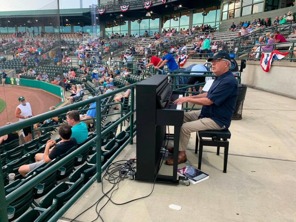 Charleston Mayor John Tecklenburg warms up at the piano before peforming the national anthem at The Joe for the Charleston RiverDogs opening day on May 4, 2021.
