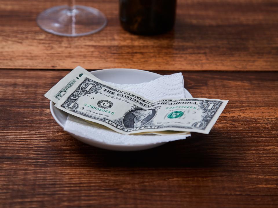 restaurant tips on a white plate