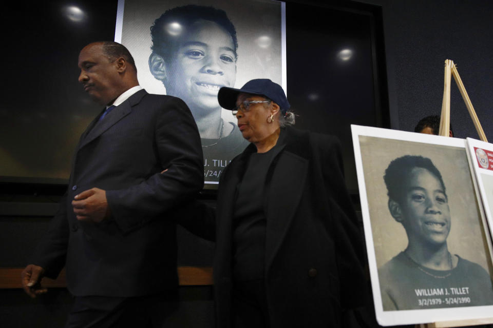 Inglewood Mayor James Butts, left, and Ruth Tillett, mother of William Tillett, leave the podium after a news conference Wednesday, Feb. 20, 2019, in Inglewood, Calif. Authorities say a 50-year-old man is in custody in connection with the kidnapping and killing of then 11-year-old William Tillett in Southern California nearly three decades ago. (AP Photo/Jae C. Hong)