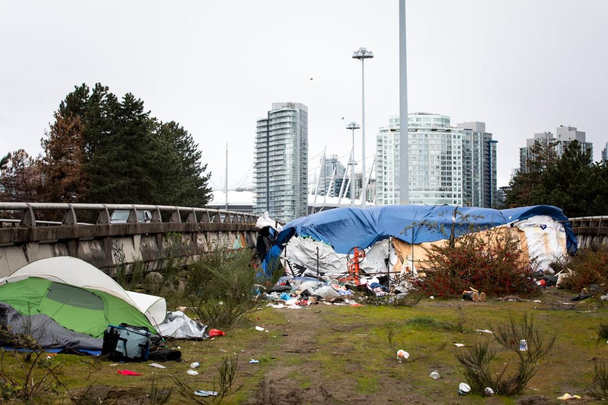 A homeless camp is shown between the viaducts in downtown Vancouver on April 18.   (Justine Boulin/CBC - image credit)