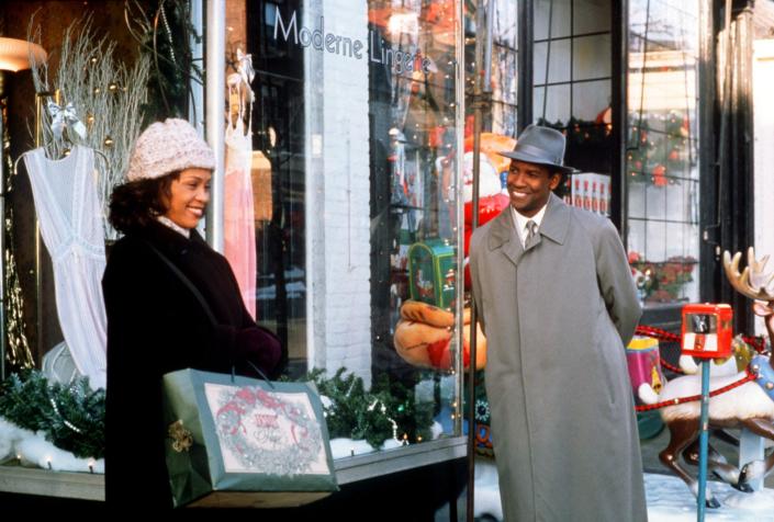 Denzel Washington, right, is an angel come to Earth who charms Whitney Houston during the Christmas season in &quot;The Preacher&#39;s Wife.&quot;