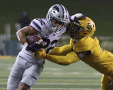 Kansas State running back Deuce Vaughn (22) is tackled Baylor linebacker Ashton Logan (34) in the first half of an NCAA college football game, Saturday, Nov. 28, 2020, in Waco, Texas. (Jerry Larson/Waco Tribune-Herald via AP)
