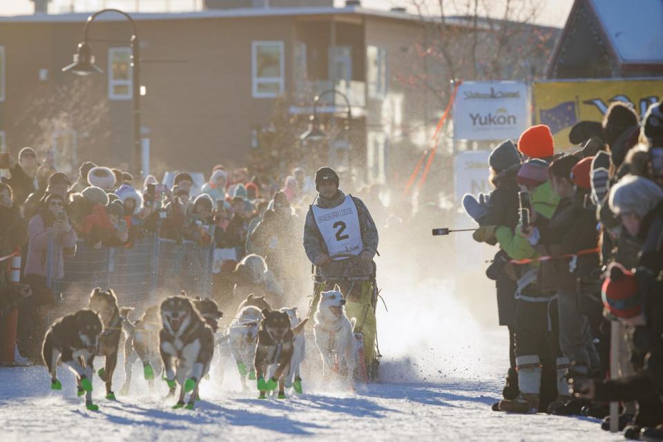 Musher Connor McMahon leaves Whitehorse at the start of the 2023 Yukon Quest dog sled race on Feb. 11, 2023.