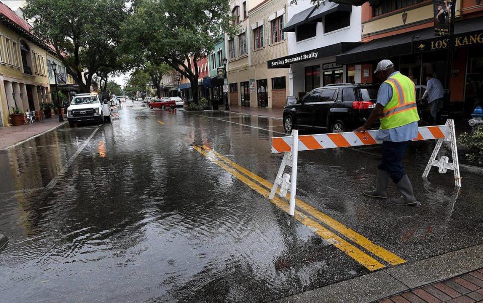 Flood insurance rates in Manatee County are increasing, according to new FEMA data. In this Bradenton Herald file photo, city of Bradenton workers install barricades on Old Main Street after a flood.