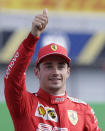 Ferrari driver Charles Leclerc of Monaco celebrates taking pole position during the qualifying session at the Monza racetrack, in Monza, Italy, Saturday, Sept. 7, 2019. The Formula one race will be held on Sunday. (AP Photo/Luca Bruno)