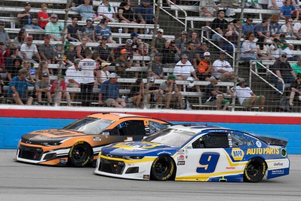 Kurt Busch, left, and Chase Elliott (9) head down the front stretch during the NASCAR Cup Series All-Star auto race at Texas Motor Speedway in Fort Worth, Texas, Sunday, June 13, 2021. (AP Photo/Larry Papke)