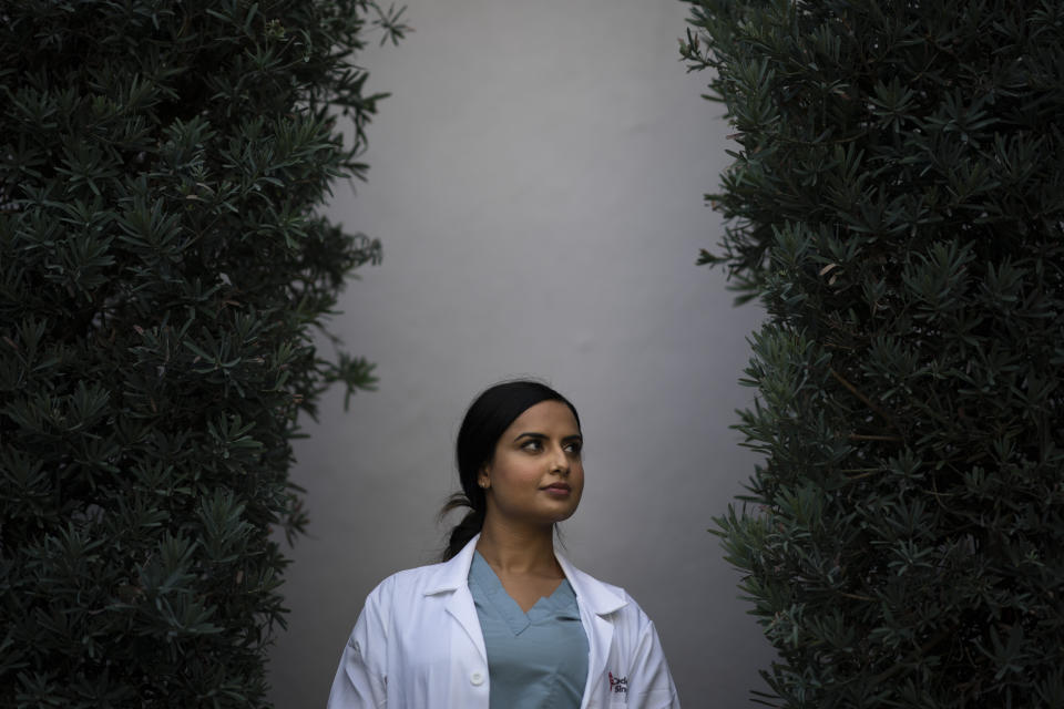 Rose Kaur Sodhi, a medical resident at Cedars-Sinai Medical Center, stands for a portrait Wednesday, Aug. 18, 2021, in Los Angeles. Rose, Balbir Singh Sodhi’s niece, was a second grader getting ready for a relative’s birthday party when her family learned of her uncle’s murder. “We knew something was terribly wrong because my dad came home crying. I had never seen that before,” she said of her father and Balbir’s brother, Rana Singh Sodhi, who became a well-known figure in the Sikh American community and taught her to share her family’s story and advocate for peace. (AP Photo/Jae C. Hong)