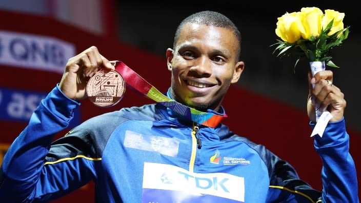 In this Oct. 2019 photo, bronze medalist Alex Quiñónez of Ecuador stands on the podium during the medal ceremony for the Men’s 200 metres final during Day Six of 17th IAAF World Athletics Championships in Doha, Qatar. (Photo: Michael Steele/Getty Images)